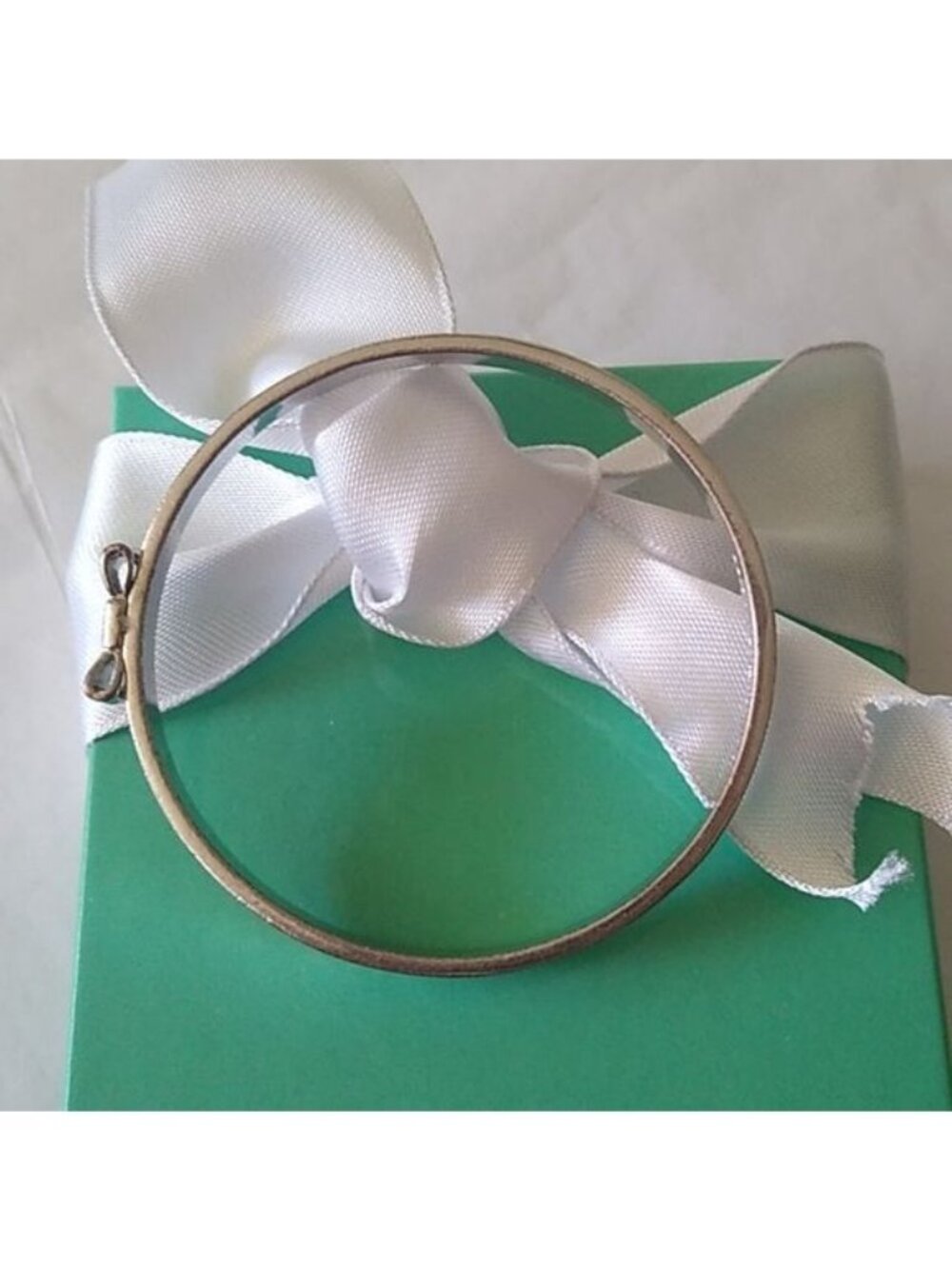 Kate Spade New York Take A Bow Bangle Bracelet, Silver, 2 3/8" opening - Picture 6 of 7